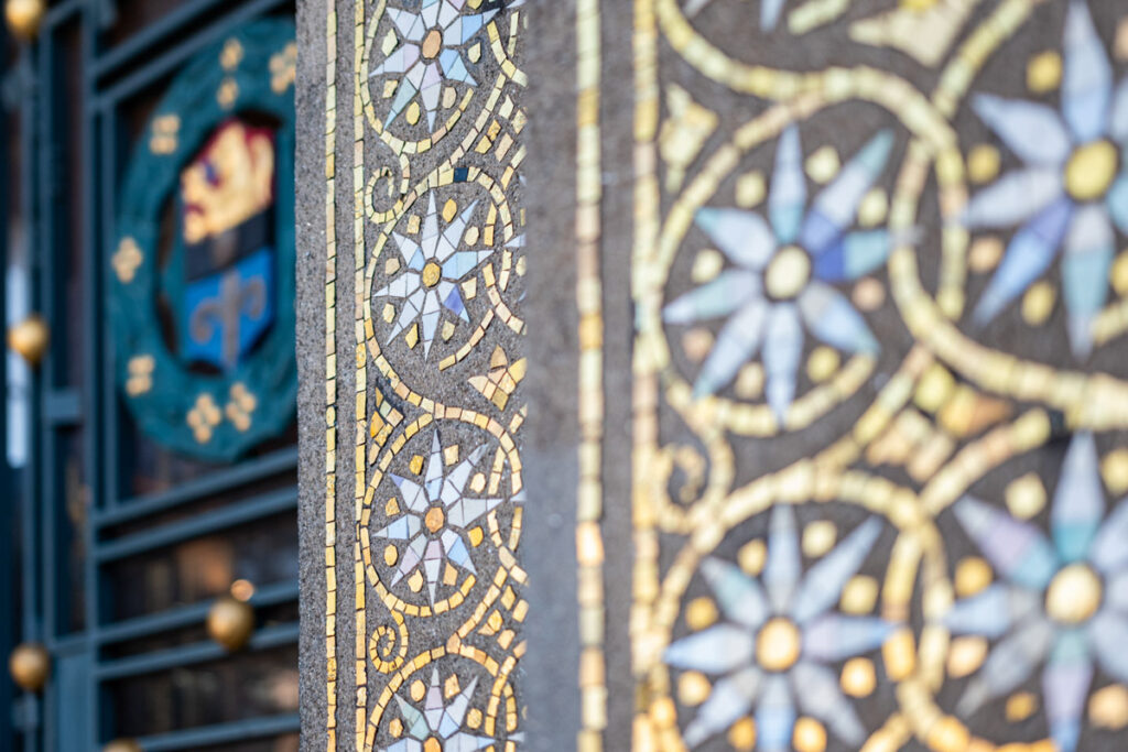 Close up of the golden mosaic ornaments around the entrance of the Wedding Tower.